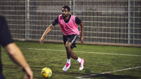 Man playing 5 a side football