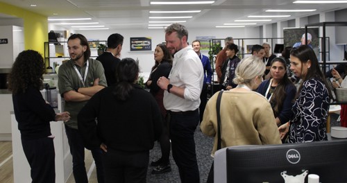 People networking at sustainability event